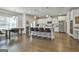 Eat-in kitchen with stainless steel appliances, a center island, and granite countertops at 33 Vinery Ct, Sharpsburg, GA 30277