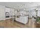 Open floor plan kitchen flows into living room offering a large island with stainless sink at 33 Vinery Ct, Sharpsburg, GA 30277