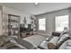 This living area is carpeted, offers natural light, and has entertainment shelving at 33 Vinery Ct, Sharpsburg, GA 30277