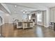 Open-concept living space featuring hardwood floors, fireplace, and natural light at 33 Vinery Ct, Sharpsburg, GA 30277