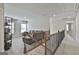 Spacious upper-level living area with natural light, carpet flooring, and a staircase at 33 Vinery Ct, Sharpsburg, GA 30277