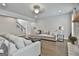Spacious living room with hardwood floors, comfortable seating, and access to staircase at 33 Vinery Ct, Sharpsburg, GA 30277