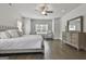 Bright primary bedroom with hardwood floors and ample natural light throughout at 33 Vinery Ct, Sharpsburg, GA 30277