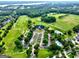 Sprawling aerial shot of the golf course and community amenities including a clubhouse and swimming pool at 1132 Hargrove Ct, Locust Grove, GA 30248