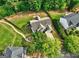An aerial perspective of a home with well-maintained lawns and a cozy, neighborhood setting at 1132 Hargrove Ct, Locust Grove, GA 30248