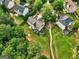 Aerial view showcasing a backyard with lawn and patio, bordered by a wooden fence at 1132 Hargrove Ct, Locust Grove, GA 30248