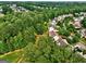 A high-angle view of a neighborhood with homes nestled among the trees at 1132 Hargrove Ct, Locust Grove, GA 30248