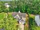 Aerial view of a home with a large yard surrounded by mature trees at 1132 Hargrove Ct, Locust Grove, GA 30248