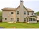 Large backyard featuring a patio, screened porch, and a well-maintained lawn at 1132 Hargrove Ct, Locust Grove, GA 30248