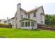 Expansive backyard with lush green grass and a screened porch for outdoor enjoyment at 1132 Hargrove Ct, Locust Grove, GA 30248