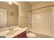 Standard bathroom featuring a shower-tub combo, toilet, and single sink vanity at 1132 Hargrove Ct, Locust Grove, GA 30248