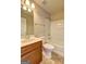 Bright bathroom featuring a vanity and shower-tub combination at 1132 Hargrove Ct, Locust Grove, GA 30248