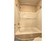 Full bathtub with shower head and faucet, ready for a relaxing bath at 1132 Hargrove Ct, Locust Grove, GA 30248