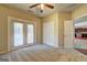 Bedroom with ceiling fan, closet, and doorway to hallway and kitchen at 1132 Hargrove Ct, Locust Grove, GA 30248