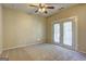 Bedroom with ceiling fan and French doors leading to the outdoors at 1132 Hargrove Ct, Locust Grove, GA 30248