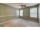 Bedroom with carpet, neutral paint and ceiling fan at 1132 Hargrove Ct, Locust Grove, GA 30248