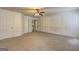 Spacious bonus room with carpet, paneled walls and entry to stairs at 1132 Hargrove Ct, Locust Grove, GA 30248