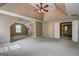 Bonus room featuring carpeted floor, ceiling fan, and view of the upstairs hall at 1132 Hargrove Ct, Locust Grove, GA 30248