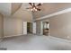 Bonus room featuring carpeted floor, ceiling fan, and view of another room at 1132 Hargrove Ct, Locust Grove, GA 30248