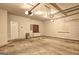 Open garage featuring a work bench, utility hookups and storage space at 1132 Hargrove Ct, Locust Grove, GA 30248