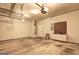 Spacious garage with utility hookups, workbench area, and automatic door opener at 1132 Hargrove Ct, Locust Grove, GA 30248