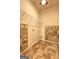 Laundry room with tile accents, storage shelf, utility hookups, and tile floor at 1132 Hargrove Ct, Locust Grove, GA 30248