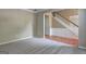 Spacious living room with hardwood floors and staircase access at 1132 Hargrove Ct, Locust Grove, GA 30248