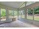 Bright sunroom featuring an AC wall unit and views of the backyard at 1132 Hargrove Ct, Locust Grove, GA 30248