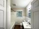 Bright bathroom with a tub, a sink, and wood-look vinyl flooring at 3158 Wisteria Way, East Point, GA 30344