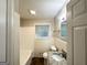 Bathroom featuring a tub and granite vanity at 3158 Wisteria Way, East Point, GA 30344