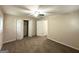 Bright bedroom featuring carpet floors, a ceiling fan, and a built-in closet at 3158 Wisteria Way, East Point, GA 30344