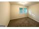 Cozy bedroom with a large window allowing plenty of natural light at 3158 Wisteria Way, East Point, GA 30344