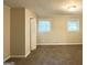 Bedroom featuring two windows bringing in natural light and a closet at 3158 Wisteria Way, East Point, GA 30344