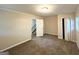 Hallway featuring the staircase and an open bedroom doorway at 3158 Wisteria Way, East Point, GA 30344