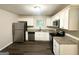 Modern kitchen featuring stainless steel appliances and granite countertops at 3158 Wisteria Way, East Point, GA 30344