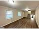 Bright living room featuring hardwood floors and neutral paint at 3158 Wisteria Way, East Point, GA 30344