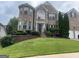 Charming two-story brick home with manicured landscaping and a welcoming front entrance at 3717 Shady Maple Dr, Stonecrest, GA 30038