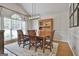 Elegant dining room with vaulted ceilings, a decorative light fixture and a large window for natural light at 505 Bracken Edge, Peachtree City, GA 30269