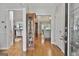 Open foyer showcasing hardwood floors and seamless transition into the living room and kitchen spaces at 505 Bracken Edge, Peachtree City, GA 30269