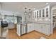 Bright kitchen featuring stainless appliances, a breakfast bar, and view to the living area at 505 Bracken Edge, Peachtree City, GA 30269