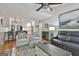 Open concept living room with hardwood floors, kitchen view, and stylish decor at 505 Bracken Edge, Peachtree City, GA 30269