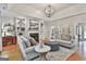 Bright and inviting living room with fireplace, hardwood floors, and stylish furnishings at 505 Bracken Edge, Peachtree City, GA 30269