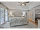 Spacious bedroom with a tray ceiling, chandelier, hardwood floors, and well lit by the windows at 505 Bracken Edge, Peachtree City, GA 30269