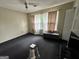 Bright bedroom with dark carpet, window with sheer curtains, and ceiling fan at 375 Leisure Sw Ct, Marietta, GA 30064