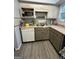 Well-equipped kitchen with modern appliances, grey cabinets, and granite countertops at 375 Leisure Sw Ct, Marietta, GA 30064