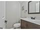 Bathroom featuring a toilet, dark brown vanity and a light countertop at 292 Twiggs Cor, Peachtree City, GA 30269