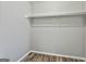 A simple closet features hardwood floors and a rod to hang clothes at 292 Twiggs Cor, Peachtree City, GA 30269