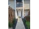 A well-kept entrance is adorned with decorative rocks, small shrubs, and a white front door at 292 Twiggs Cor, Peachtree City, GA 30269