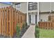 Charming townhouse entrance with decorative rock landscaping and wood fencing at 292 Twiggs Cor, Peachtree City, GA 30269