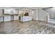Open kitchen with white cabinets, granite countertops, and decorative backsplash at 292 Twiggs Cor, Peachtree City, GA 30269